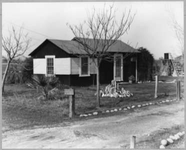 Olivehurst, Yuba County, California. One of the 26 homes on Second Avenue Older settler. Note sign . . . - NARA - 521580 photo