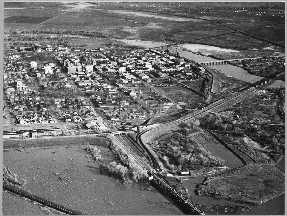 Olivehurst, 2 miles south of Marysville, Yuba County, California. Air view of the city of Marysville . . . - NARA - 521573