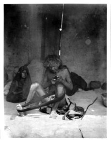 Old blind man winding yarn with a young girl watching, Arizona, ca.1898 (CHS-4572)