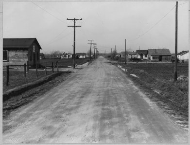 Olivehurst, Yuba County, California. Looking down Second Avenue from Olivehurst to the west. This st . . . - NARA - 521577 photo