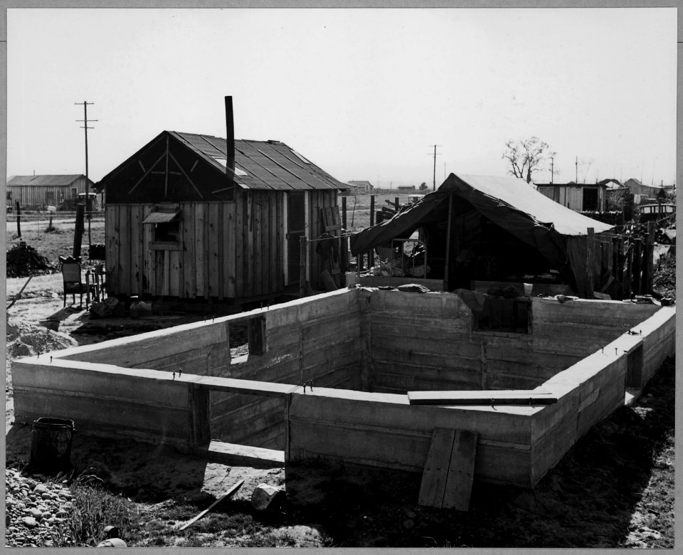Olivehurst, Yuba County, California. Shows cabin in which this family now lives, and tent (now used . . . - NARA - 521588