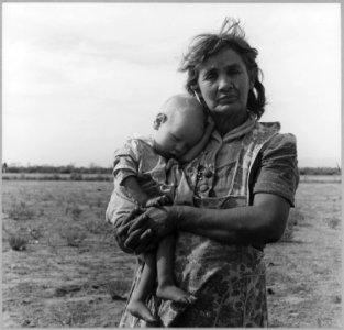 On Arizona Highway 87, south of Chandler, Arizona. Grandmother and sick baby of migratory family ca . . . - NARA - 522206