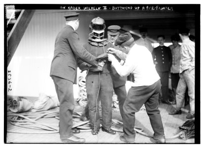 On KAISER WILHELM II - Buttoning up a fire-fighter LCCN2014691581