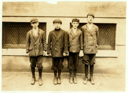 On left end of picture is Thomas Kelley, 275 Lakeview Avenue, has been doffing in lower spinning room No. 2 for one month. Appears 12 or 13 years. Next to Thomas are Patrick and Walter. (See LOC cph.3b43672