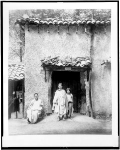 One Arab man and two Arab children in front of Kabyle house, Paris Exposition, 1889 LCCN94500795