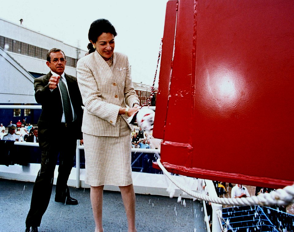 Olympia Snowe breaks the traditional bottle of champagne across the bow of the guided missile destroyer USS MASON (DDG 87)