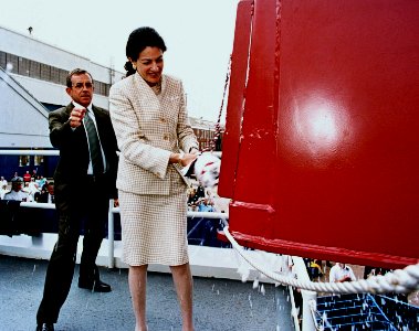 Olympia Snowe breaks the traditional bottle of champagne across the bow of the guided missile destroyer USS MASON (DDG 87)