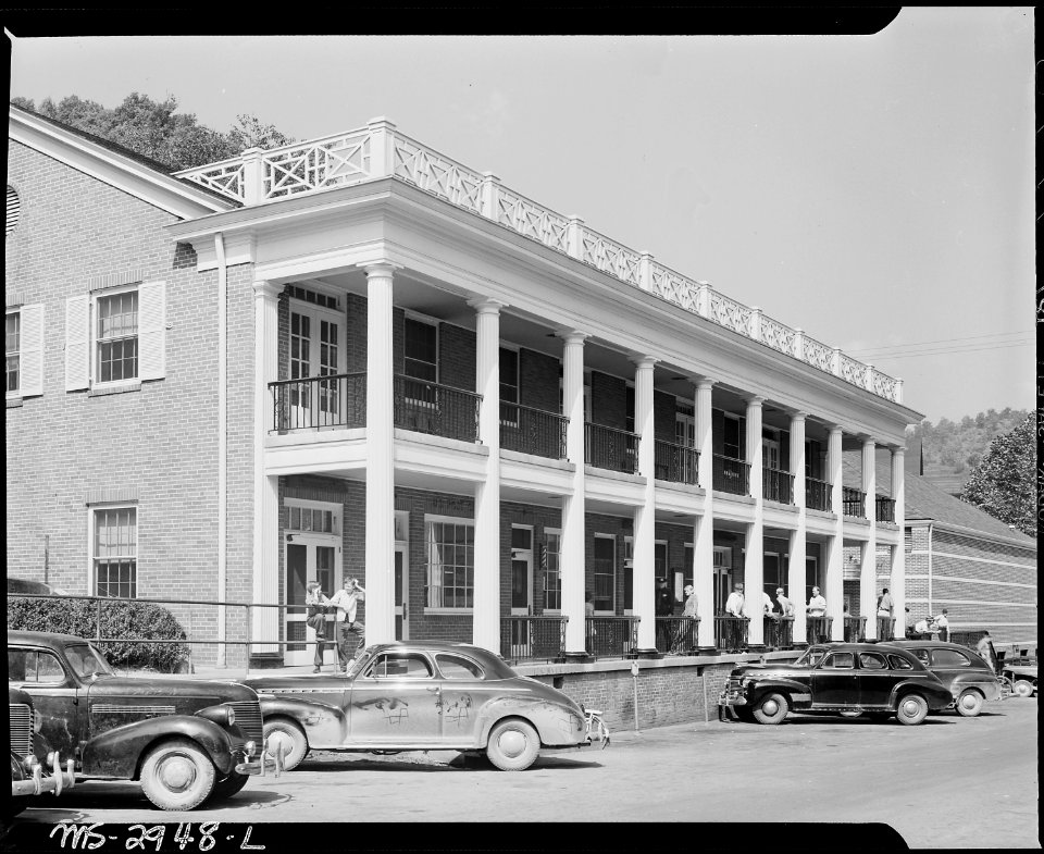 One of the buildings on main street, contains community hall, post office, restaurant, barber shop, soda fountain... - NARA - 541422