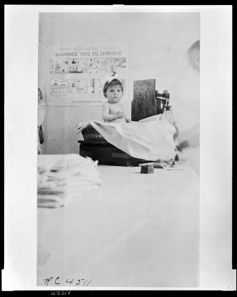 One of the Greek babies on the scale at the Athens infant welfare clinic operated by the (erased). American nurses are helping to care for many of the Greek babies in the Hellenic capital LCCN2010648491