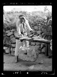 Olive crushing and pressing. Process of winding the suspended weight on a rod resting on the forked beam LOC matpc.15647