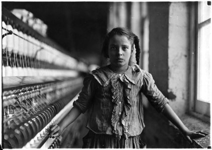 One of the spinners in Whitnel Cotton Mill. She was 51 inches high. Has been in the mill one year. Sometimes works at... - NARA - 523145