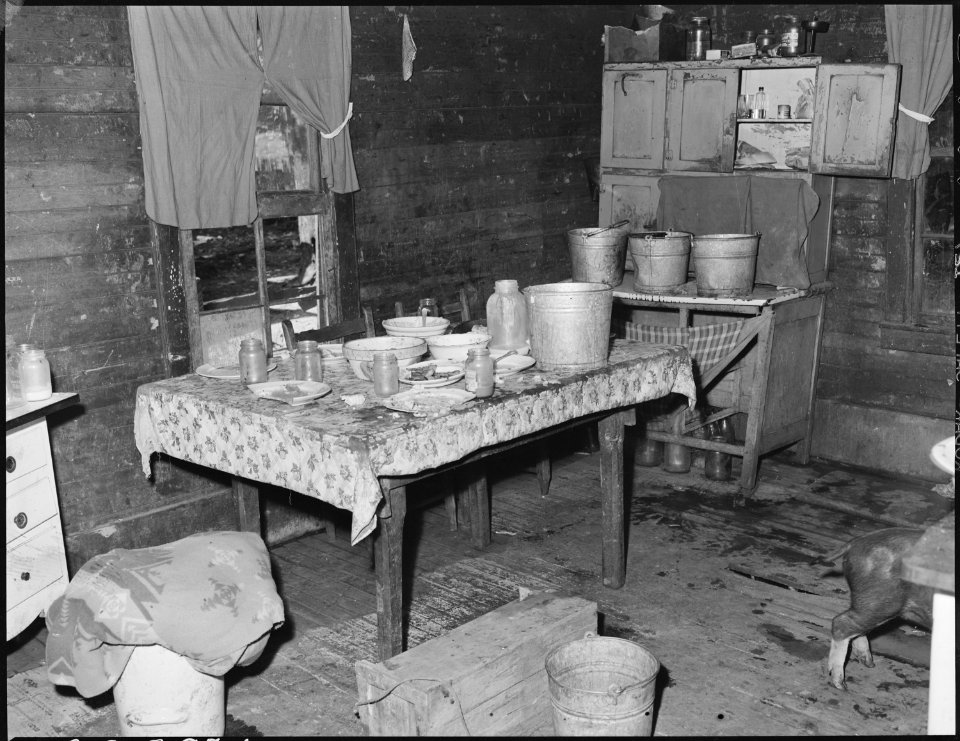One of the three rooms renting for $4 monthly in which eight people, four adults and four children live. This house... - NARA - 541173