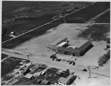 Olivehurst, Yuba County, California. Air view of Olivehurst school enlarged to accommodate migrant c . . . - NARA - 521592 photo