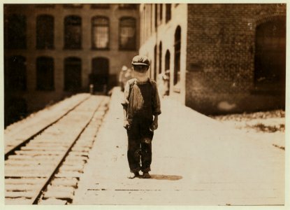 One of the young doffers in Washington Cotton Mills, Fries, Va., going to dinner. Said he was 15 years old, but it is doubtful. LOC nclc.01883