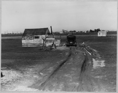 Olivehurst, Yuba County, California. Another view of home on Second Avenue.... Note tent in rear bel . . . - NARA - 521582