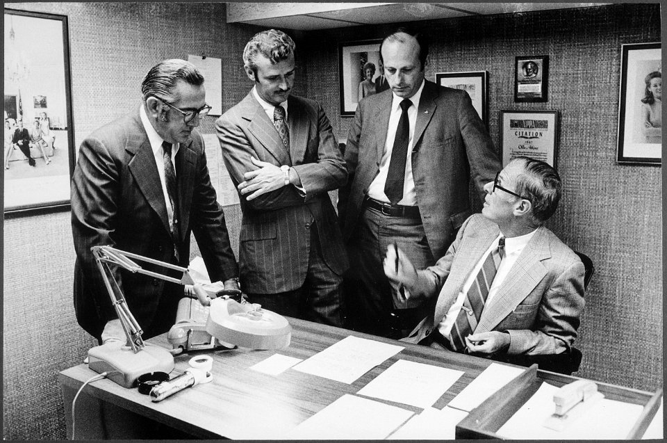 Ollie Atkins confering with the White House photo office staff. - NARA - 194766