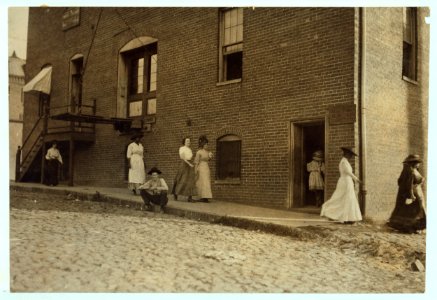 One of the very little girls (going through door) that roll cigarettes in the Danville (Va.) Cigarette Factory. See other photos at noon. Taken at 6-45 A.M. LOC nclc.04741