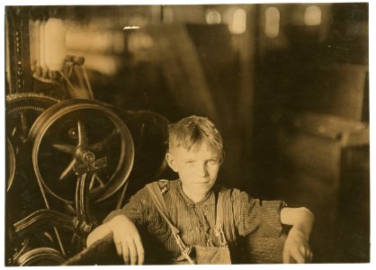 One of the young spinners in the Quidwick Co. Mill. Anthony, R. I. (A Polish boy Willie) who was taking his noon rest in a doffer-box. LOC cph.3a20284