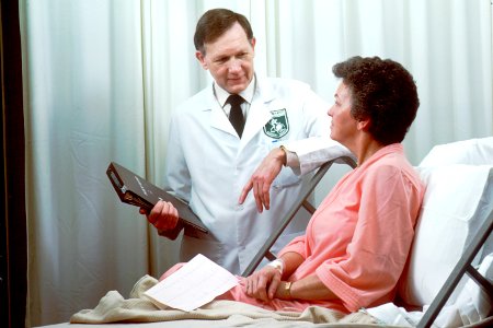 Oncology doctor consults with patient photo