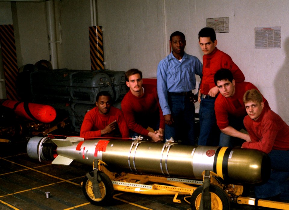 Ordnancemen with Mk 46 torpedo on CVN-69 1988