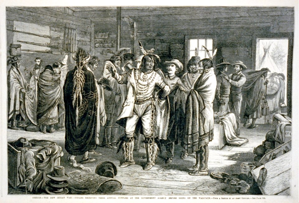 Oregon - the new Indian war - Indians receiving their annual supplies at the government agency before going on the war path (Indians receiving fancy clothing) LCCN2001696521