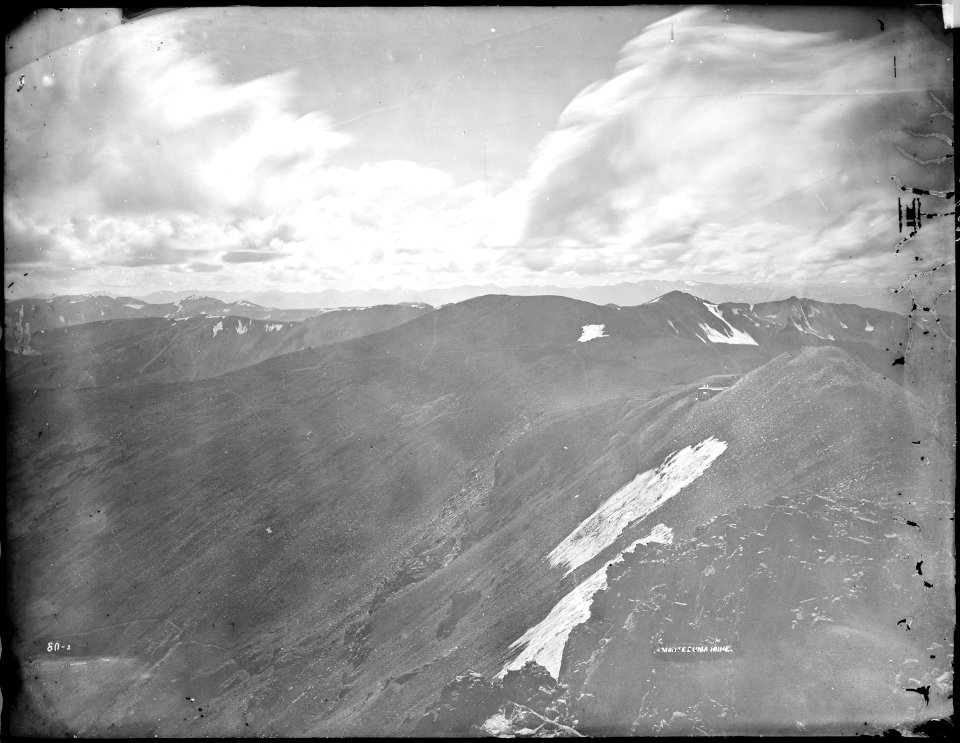 Panorama from summit of Mount Lincoln at west end of South Park, Colorado, showing Montezuma mine and Sawatch range. - NARA - 517680