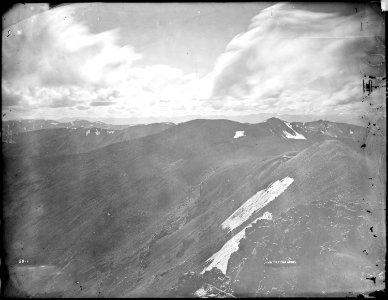 Panorama from summit of Mount Lincoln at west end of South Park, Colorado, showing Montezuma mine and Sawatch range. - NARA - 517680