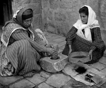 Palestinian women grinding coffee beans photo