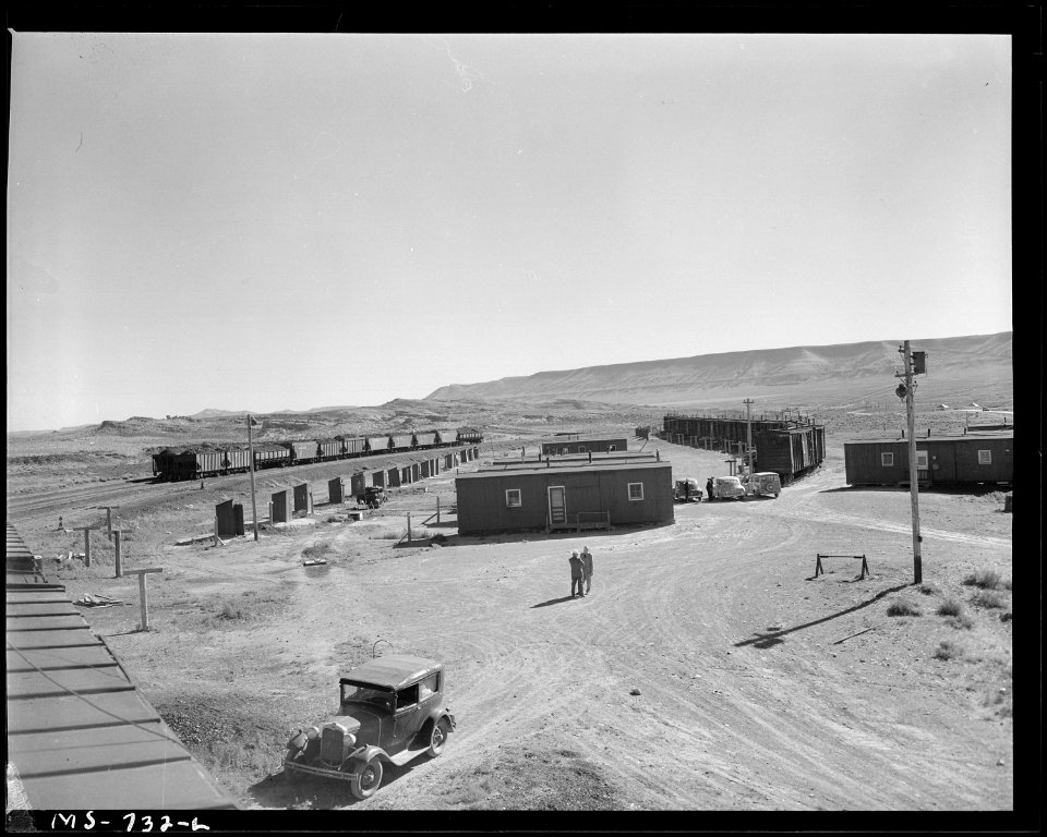 Part of box car homes in company housing project for miners. Note that some cars have been placed on concrete... - NARA - 540573