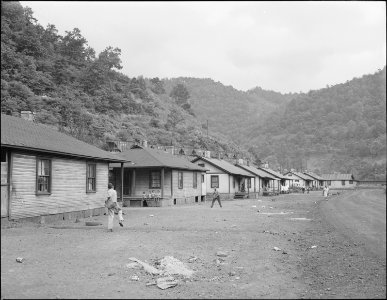 Part of company housing project for miners. Space between houses and roads is used for baseball and other sports.... - NARA - 540688 photo