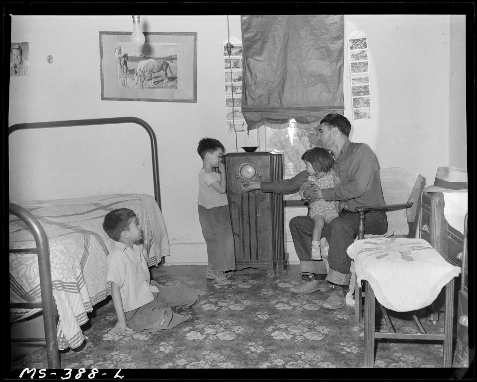 Part of family of Lawrence Trujillo in living room of their home in company housing project. Colorado Fuel & Iron... - NARA - 540386