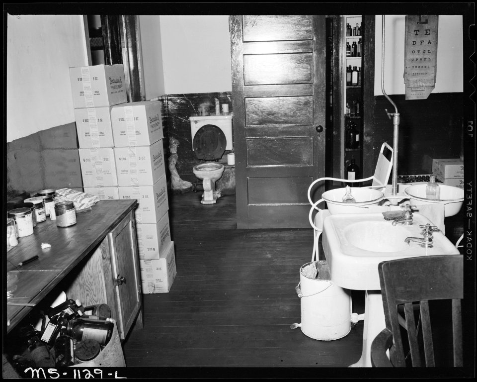 Part of main treatment room in company dispensary. Note condition of toilet in left rear. Kingston Pocahontas Coal... - NARA - 540681