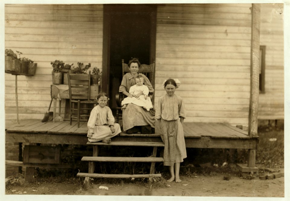 Part of the family of R.D. Thomas. He and a boy of 15 are working in the Century Cotton Mill, South Boston, Va. The girl on the ground does not work now, but said she was 12 years old (which LOC nclc.02176