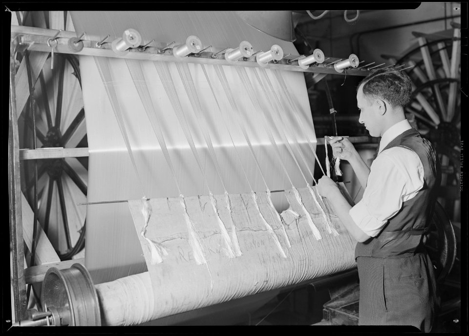Paterson, New Jersey - Textiles. After all the sections required for the warp have been wound on to the frame, the... - NARA - 518558