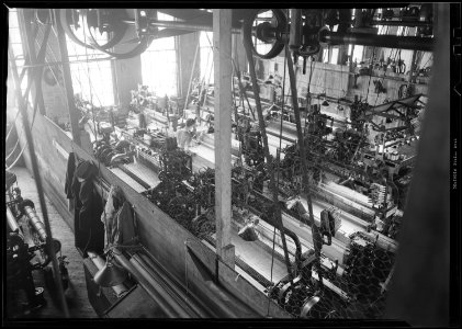 Paterson, New Jersey - Textiles. Idle quilling machines and looms in a cockroach shop. - NARA - 518569