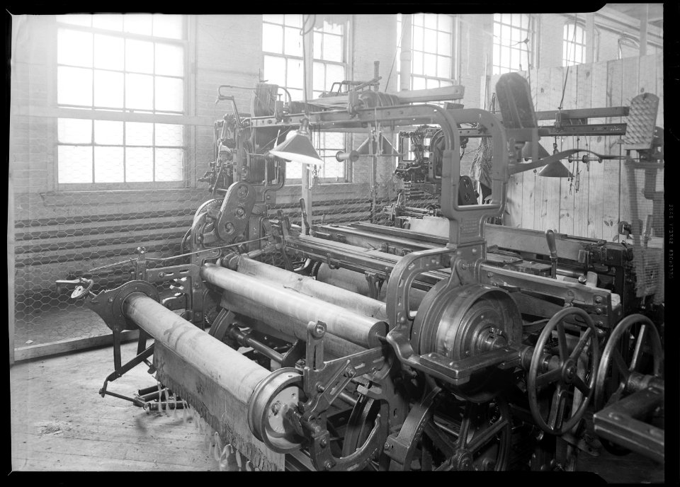 Paterson, New Jersey - Textiles. Idle quilling machines and looms in a cockroach shop. Note partition on the right... - NARA - 518567