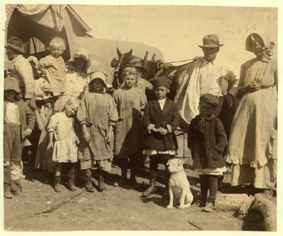 Part of a group of itinerant cotton pickers leaving a farm at which they had finished picking a bale and a half a day. They live in these wagons. Note how many children - all pick except the LOC nclc.00220