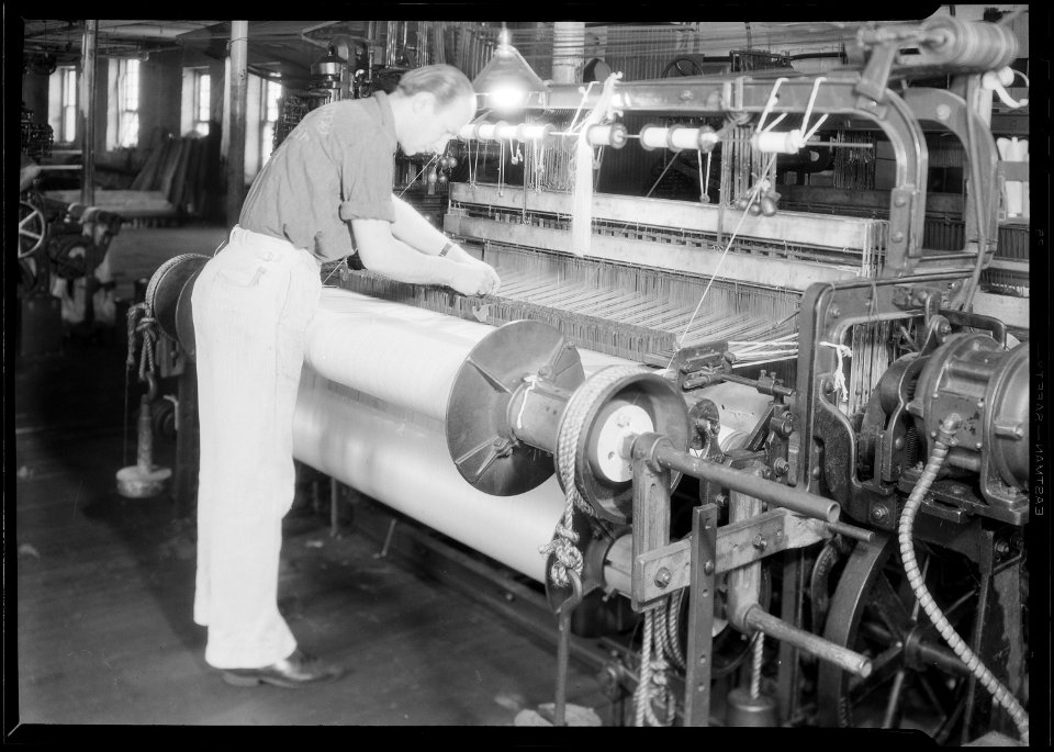 Paterson, New Jersey - Textiles. Wishnack Silk Company. Back view of the same loom showing the double beam. A single... - NARA - 518760