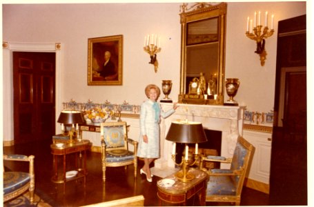 Pat Nixon Standing in the Blue Room, and receiving Flowers from Unidentified Men