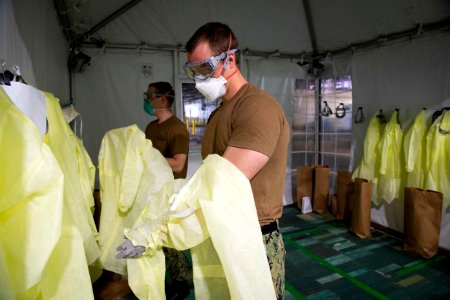 Patient Transport Team Receives Patients Arriving for Medical Care Aboard the Military Sealift Command hospital ship USNS Comfort (T-AH 20) (49758522427) photo