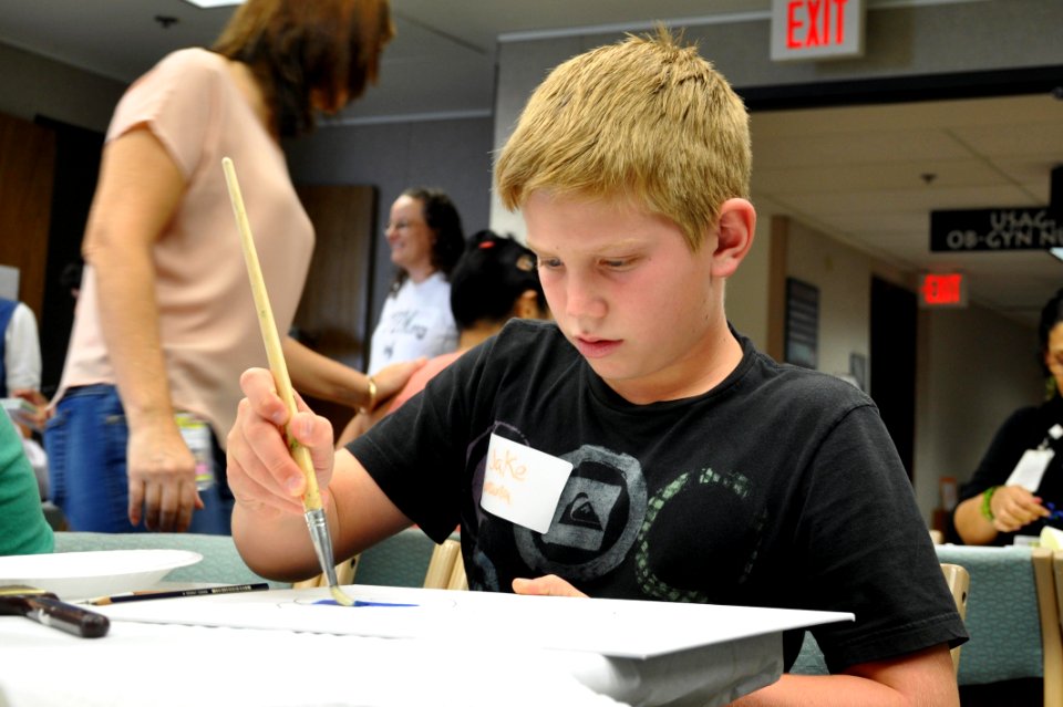 Patients, survivors and family members participate in Oncology on Canvas 130419-N-PJ759-003