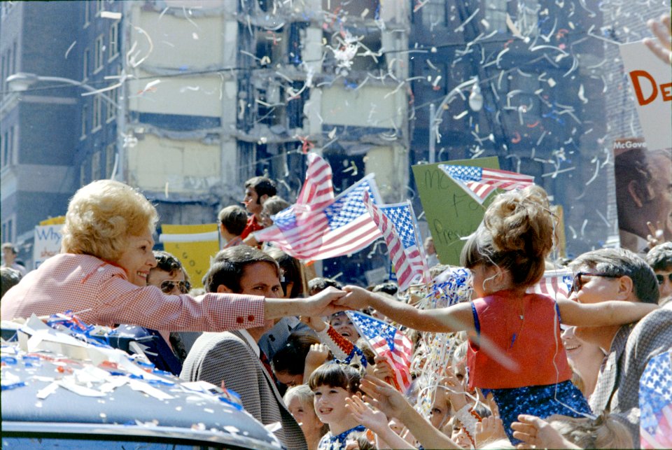 Pat Nixon Stretches from Limousine Window to Hold the Hand of a Young Girl, during a Motorcade in Atlanta, Georgia