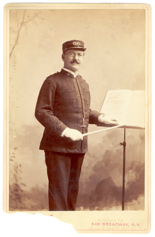 Patrick S. Gilmore, three-quarter length portrait, standing, facing slightly right, wearing music conductor uniform LCCN99471795