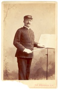 Patrick S. Gilmore, three-quarter length portrait, standing, facing slightly right, wearing music conductor uniform LCCN99471795