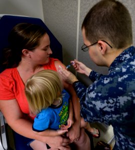 Patients receive flu vaccination at Naval Health Clinic Hawaii 151001-N-GI544-080