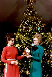 Pat Nixon and Julie Nixon Eisenhower Examine One of the Handmade State Christmas Tree Ornaments photo