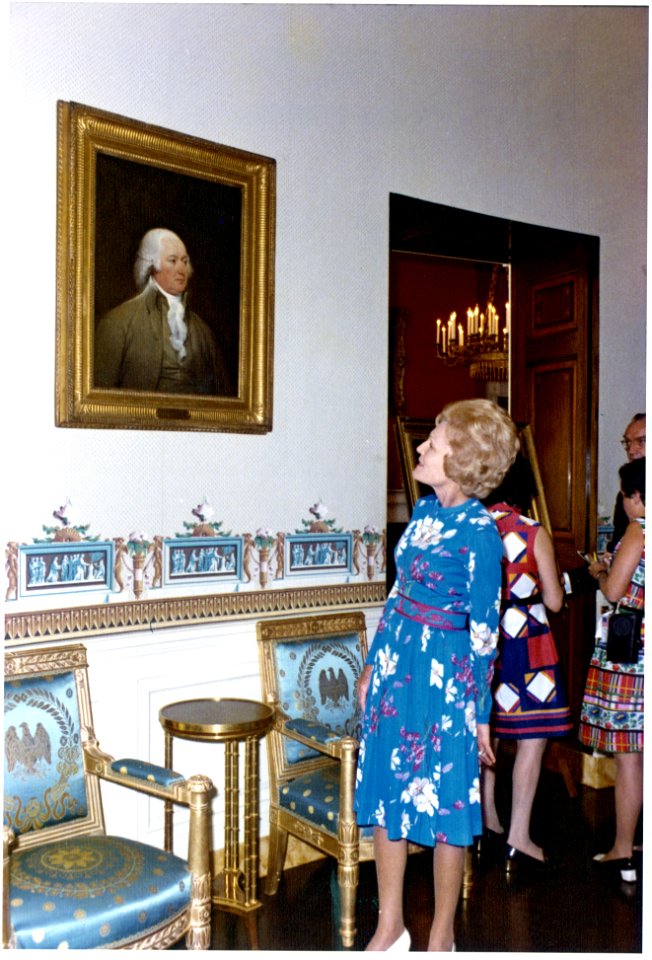 Pat Nixon Standing by a Portrait of John Adams