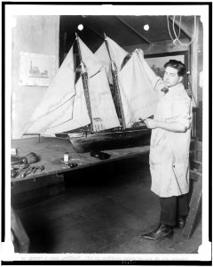 Paul E. Garber of the Construction Department of the National Museum with ship model LCCN95504273