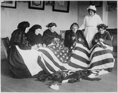 Patriotic old women make flags. Born in Hungary, Galicia, Russia, Germany, Rumania. Their flag-making instructor, Rose R - NARA - 533657