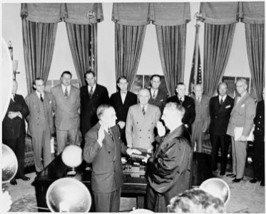 Paul Hoffman is sworn in by Chief Justice Fred Vinson as administrator of the Economic Recovery Corporation in a... - NARA - 199759 photo